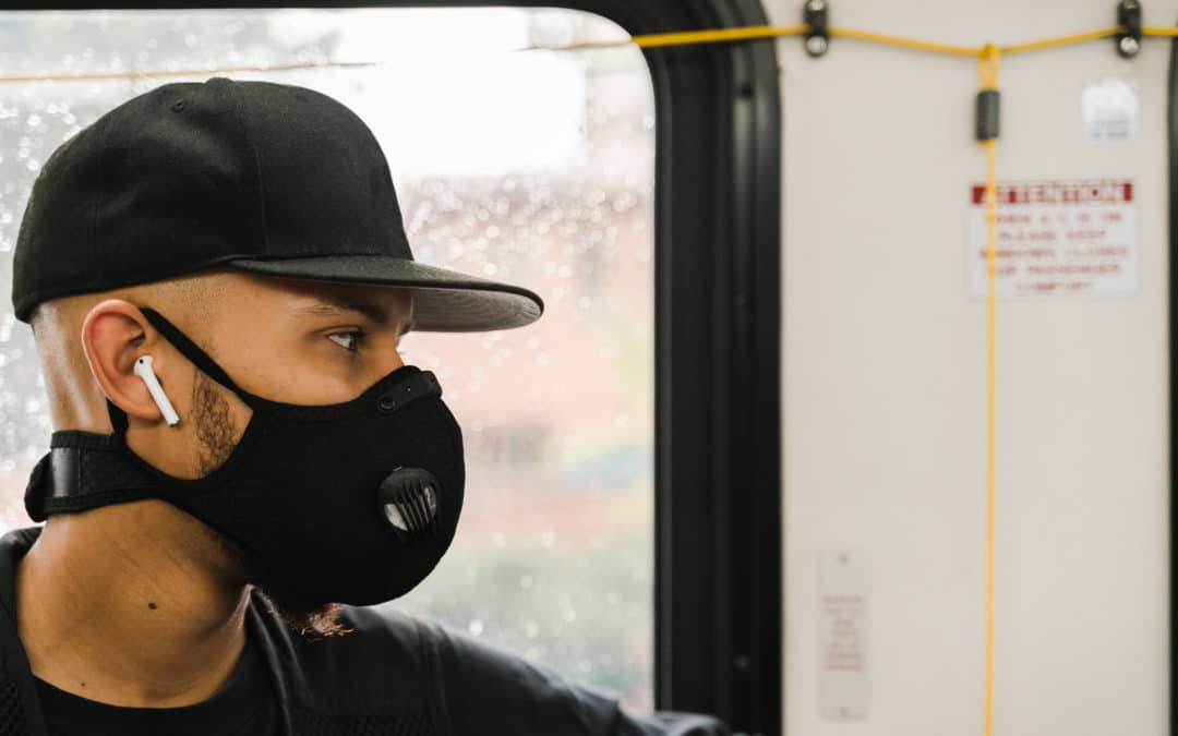 man-wearing-mask-while-riding-the-subway-SBI-346271427