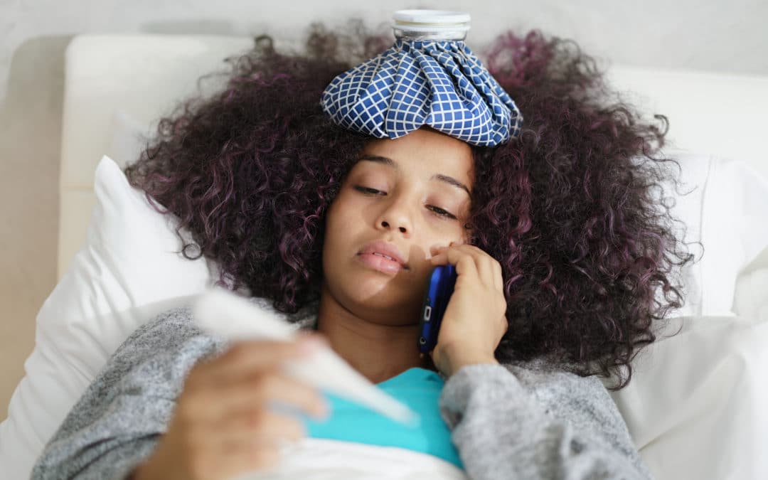 Woman With Fever Using Thermometer And Calling Doctor By Phone